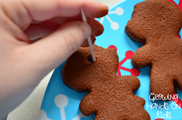 An easy recipe for homemade cinnamon applesauce ornaments, a perfect sensory experience for kids.