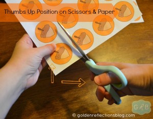 Thumbs up position on scissors