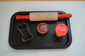 Dog themed play dough tray for montessori inspired tot school week.