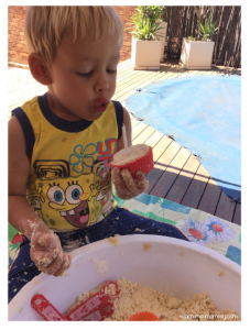 Birthday party pretend play with cloud dough for sensory play.