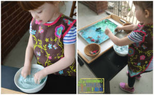 Earth day sensory play activity with shaving cream and miniature animals.