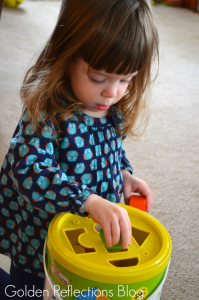 Matching and problem solving skills with wooden blocks for developmental play. www.GoldenReflectionsBlog.com