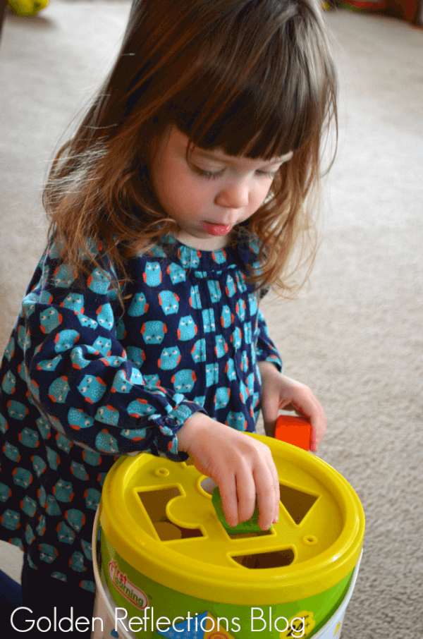 Matching and problem solving skills with wooden blocks for developmental play. www.GoldenReflectionsBlog.com