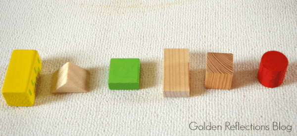 Learning patterns, colors, and shapes with wooden blocks for developmental play. www.GoldenReflectionsBlog.com