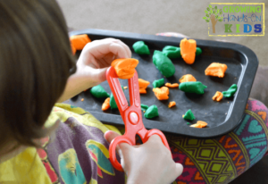 Introducing scissor skills to toddlers.