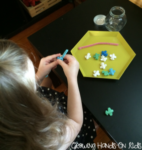 Letter A stringing Airplane beads.