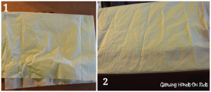 tissue paper kicking on the DIY discovery box for baby.