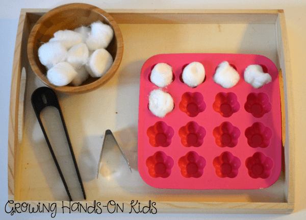 Letter C cotton ball transfer tray for fine motor skills.