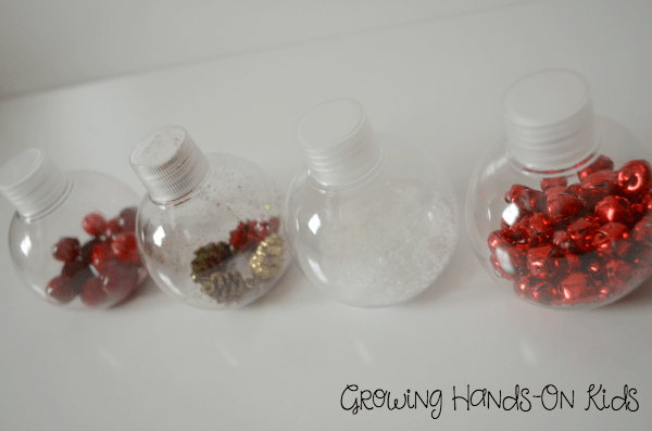 Christmas discovery bottles for baby, perfect for tummy time by the tree. 