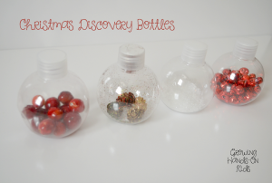 Christmas discovery bottles for baby, perfect for tummy time by the tree.