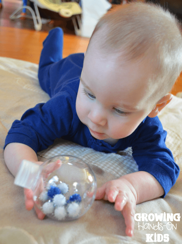 Winter discovery bottles for baby tummy time play.