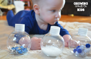 Winter discovery bottles for baby tummy time play.