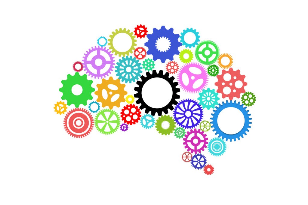 human brain shape with multi-colored gears.