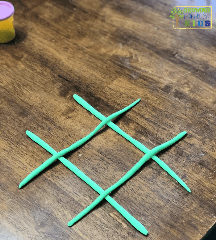 Play dough tic-tac-toe game. Pre-writing activity for kids.
