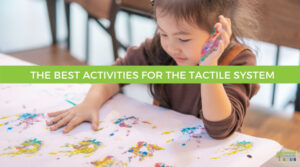 little girl finger painting on white paper. A green shaded box with the words The Best Activities for The Tactile System are at the top of the picture.