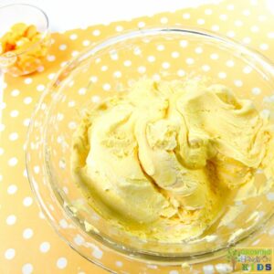 yellow cloud dough mixture in mixing bowl.