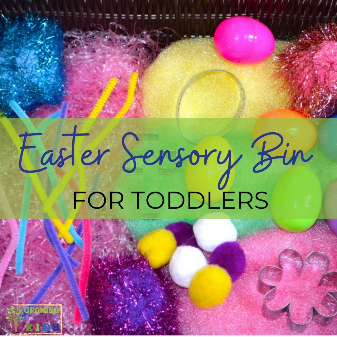 Photo of an Easter sensory bin for toddlers filled with Easter grass, eggs, pipe cleaners, cookie cutters, and more.